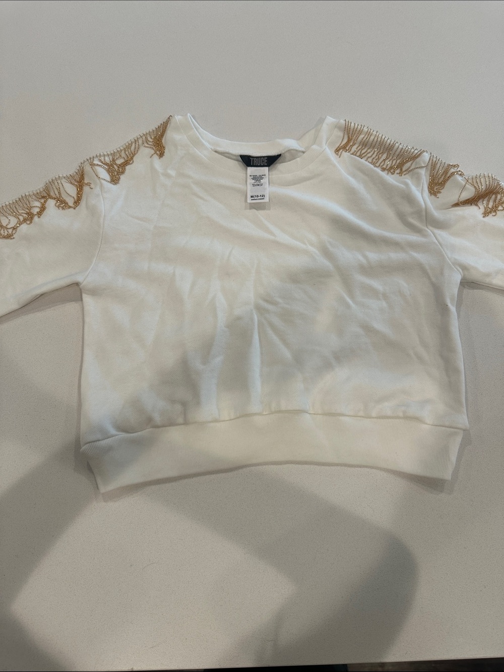 Truce Girls' White Cropped Sweatshirt with Gold Fringe Accents